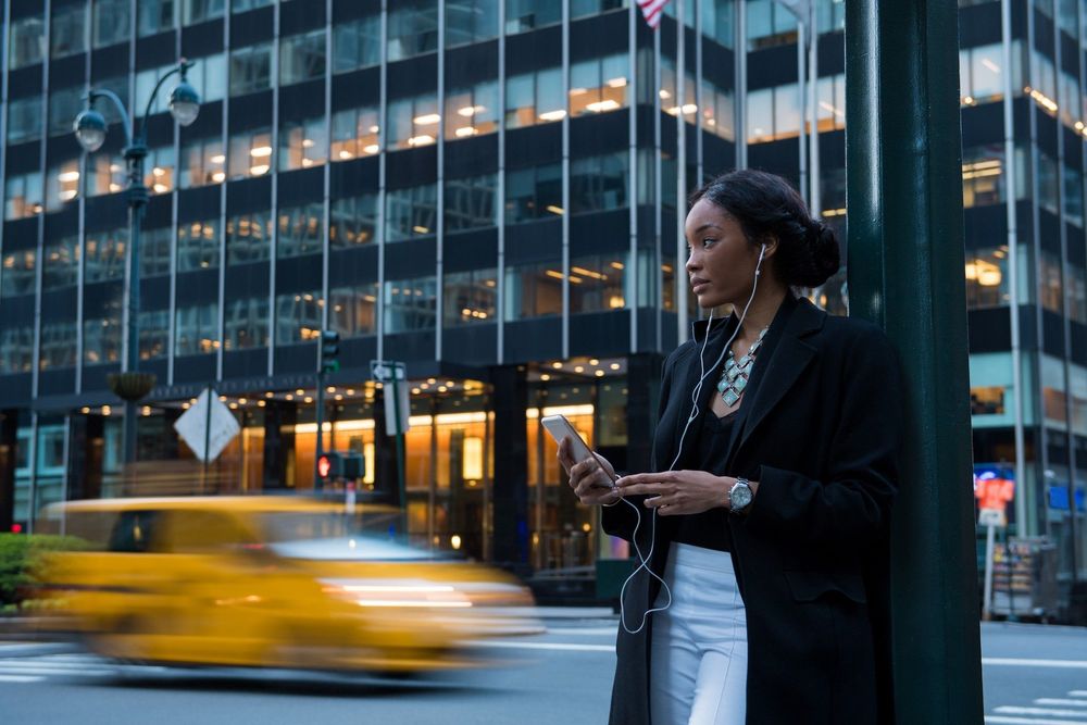 Woman on phone in busy street