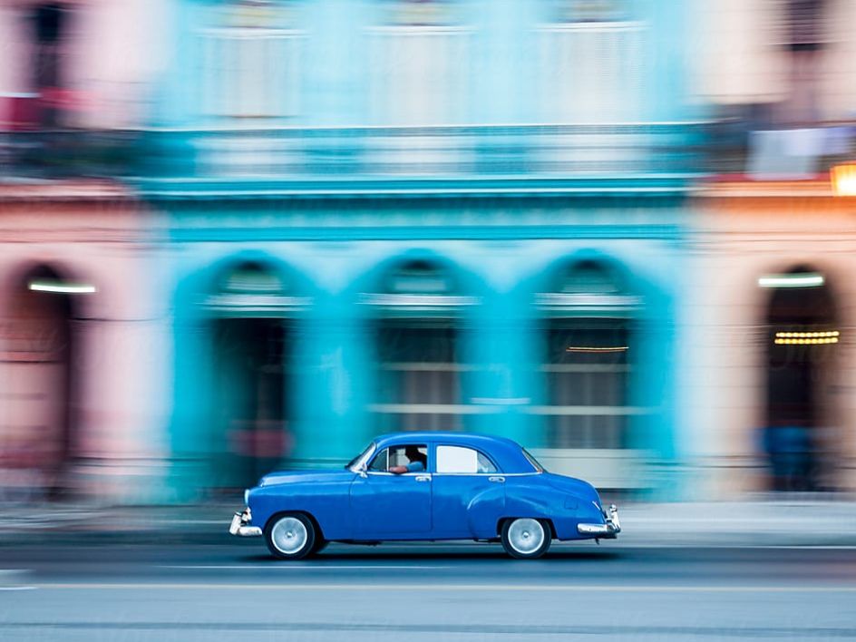 Car driving down street