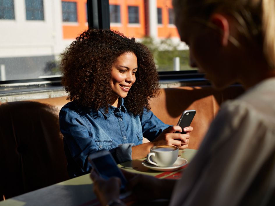 Woman smiling looking at phone