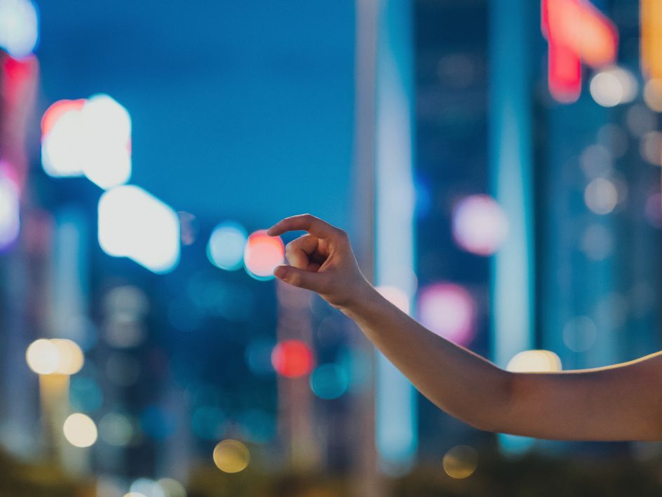 Hand reaching at window