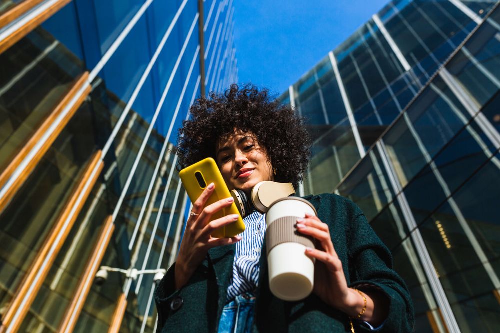 Woman staring down at her phone