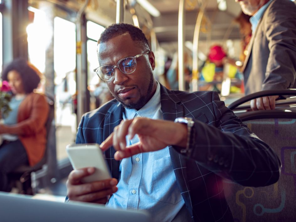 Man looking at forex on phone